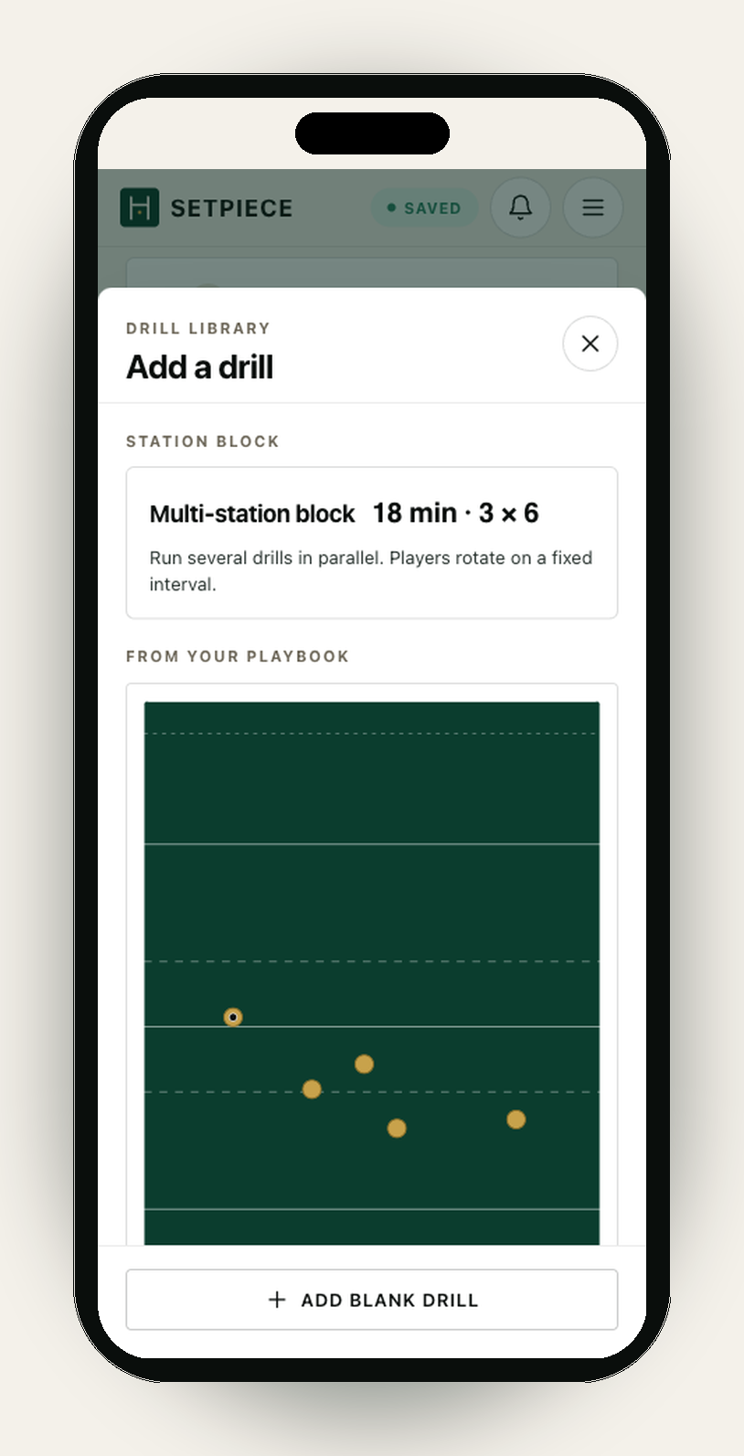The 'Drill library · Add a drill' picker, opened as a sheet over the session planner on an iPhone. The sheet lists ready-made drills to drop into the open session. At the top, a 'Station block' card offers a Multi-station block (18 min · 3 × 6) for running drills in parallel with player rotations. Below, a 'From your playbook' section shows the 'Slider' play with its pitch thumbnail, so an existing play can be dropped straight into the session. A pinned '+ Add blank drill' button sits at the bottom of the sheet.