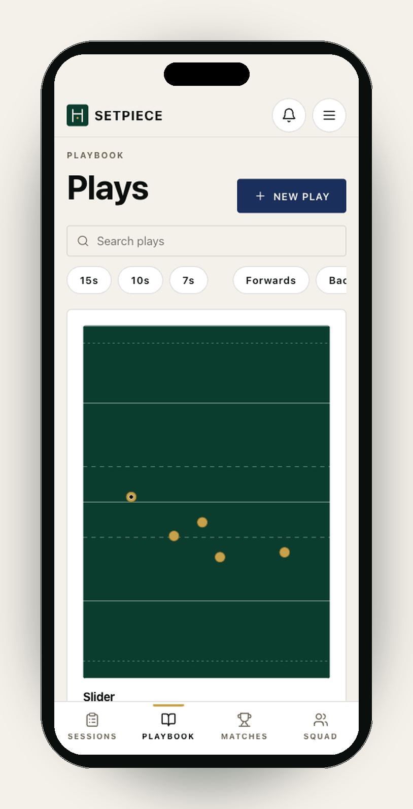 The SetPiece playbook list on an iPhone — the searchable library of plays a coach drops into sessions. Header reads 'Playbook · Plays' with a navy '+ New play' button. Below, a search bar 'Search plays…' and a row of game-mode and band filter chips (15s, 10s, 7s, Forwards, Backs). The first play is 'Slider', shown with a thumbnail of its rugby pitch and metadata badges for players, lines and events.